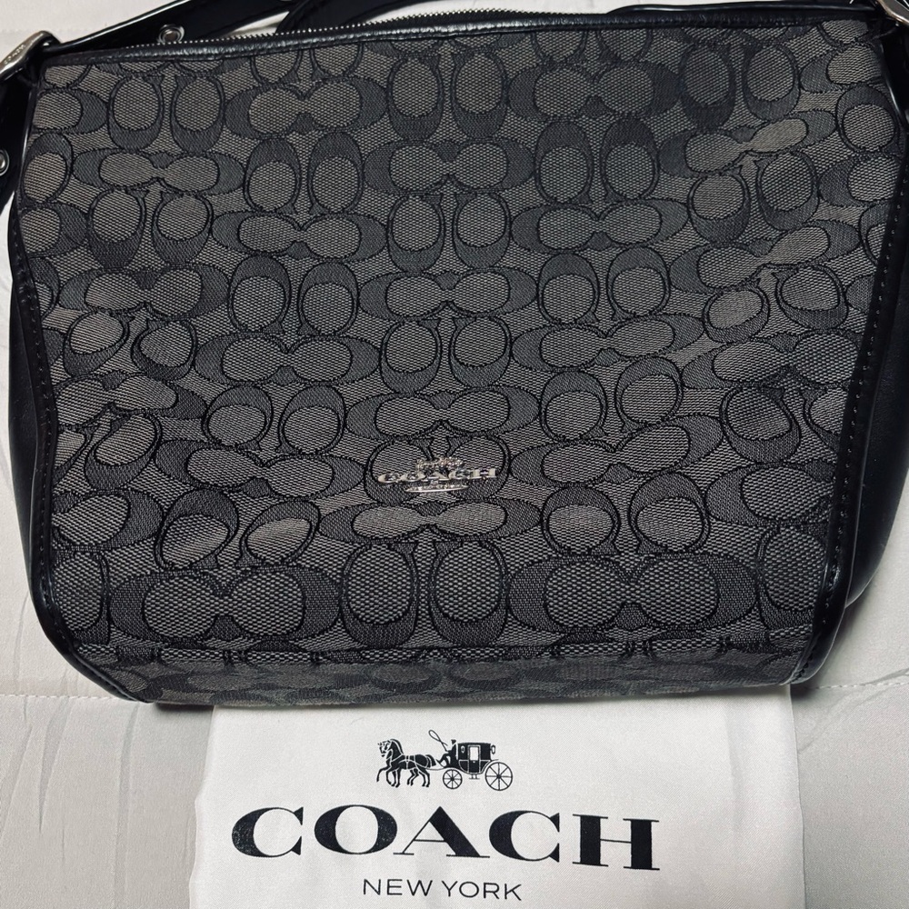 Black & Gray Coach Messinger bag. 10 (W) X 9 
1/2 (L)